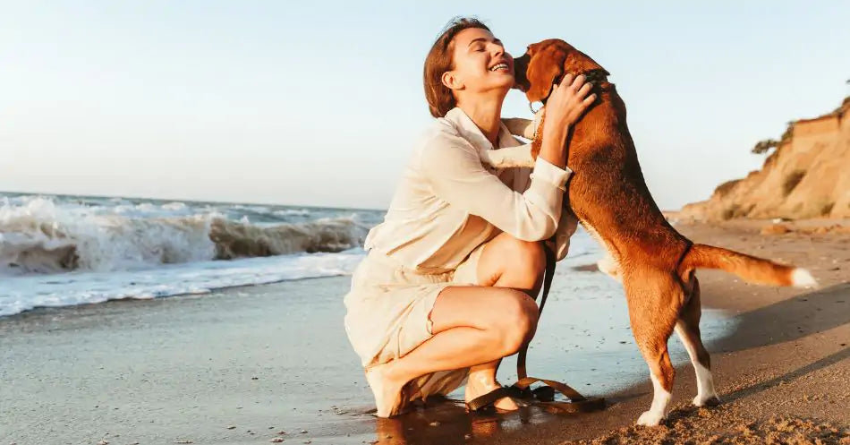 a woman hugging a dog