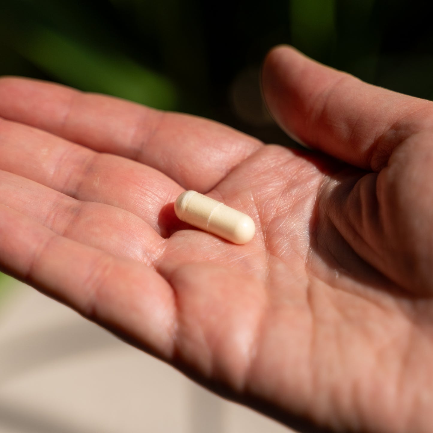 omega-3 capsule in the palm of hand