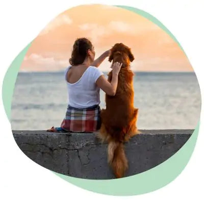 woman sitting with dog
