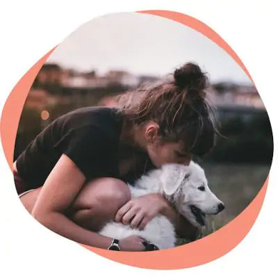 dog mom hugging her dog