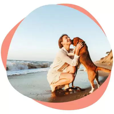 a woman hugging a dog