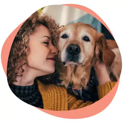 woman comforting senior dog